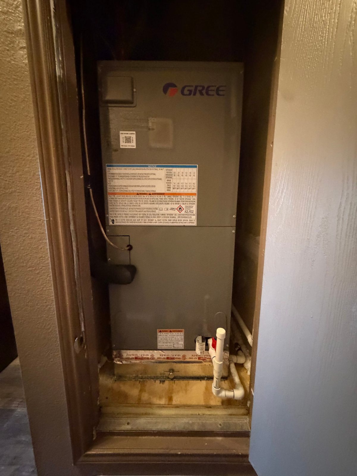 GREE FLEXX Ultra air handler installed in a hall closet with new drain connections in Burleson, TX
