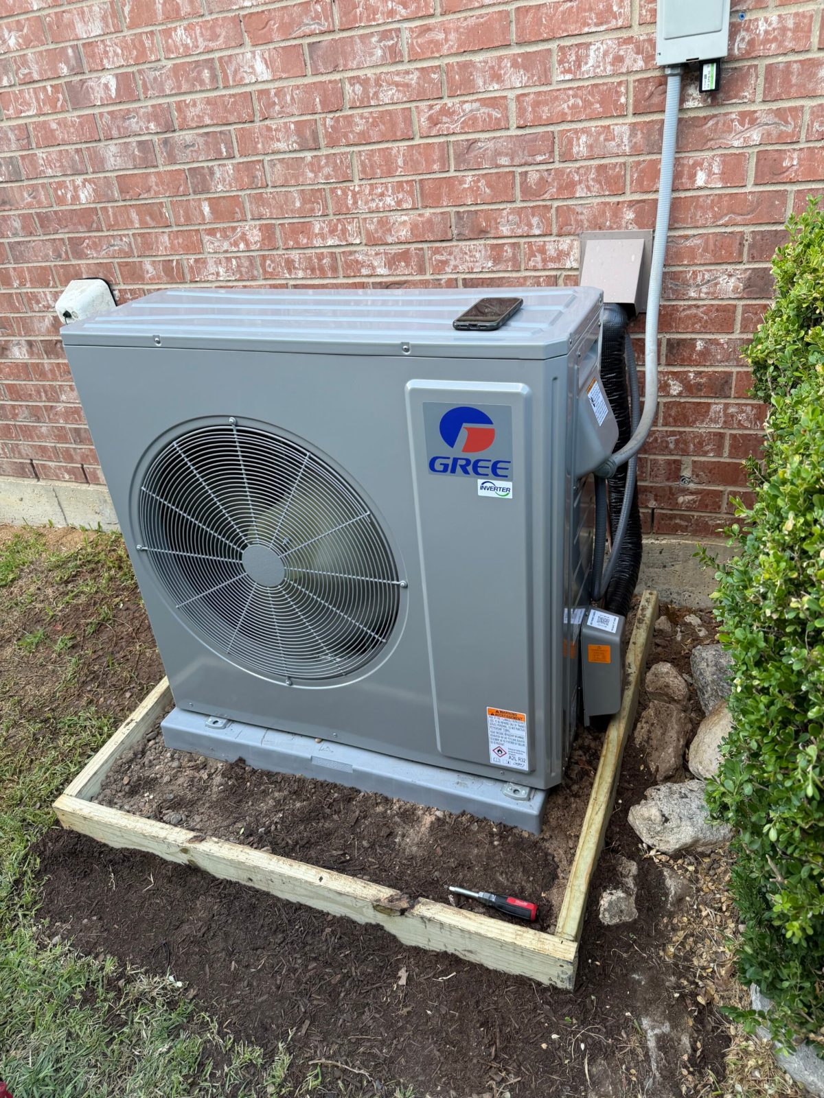 GREE inverter outdoor unit with new electrical disconnect and line set cover in Burleson, TX